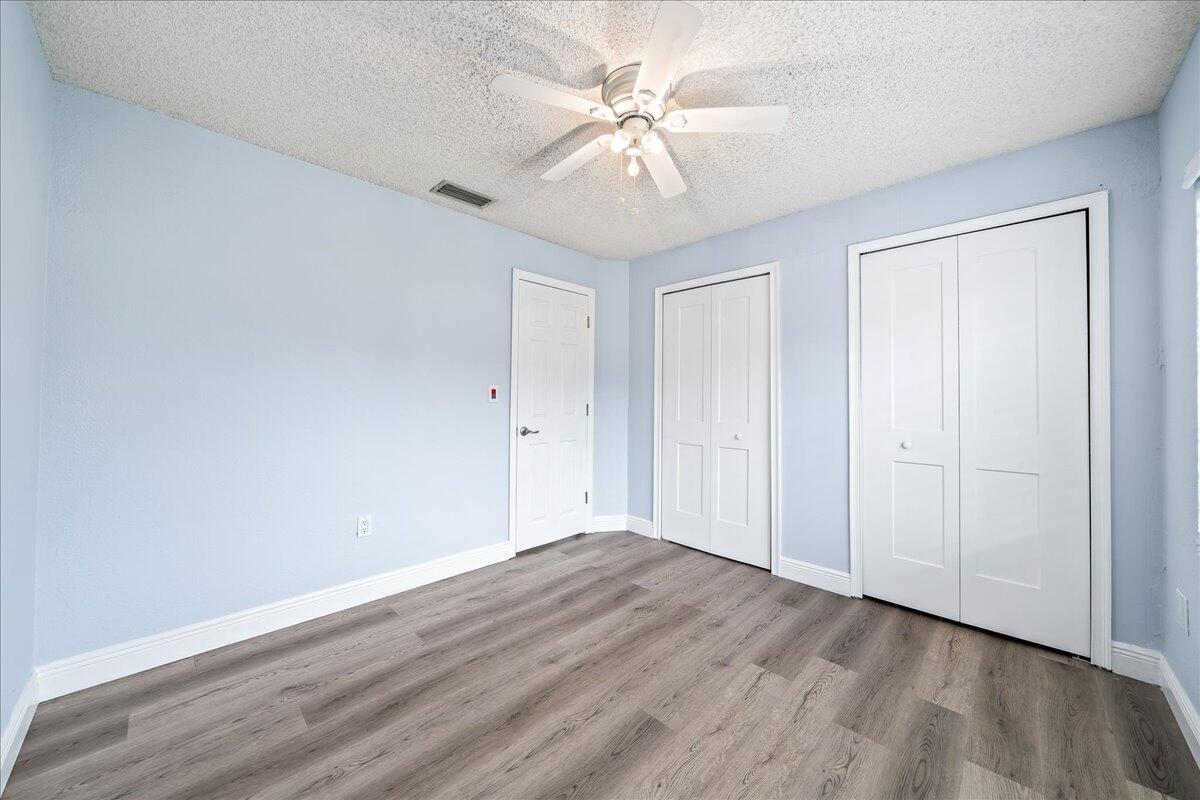 124 Monaco Road Melbourne, FL 32904 - Photo 14 of 24 wooden floor in an empty room