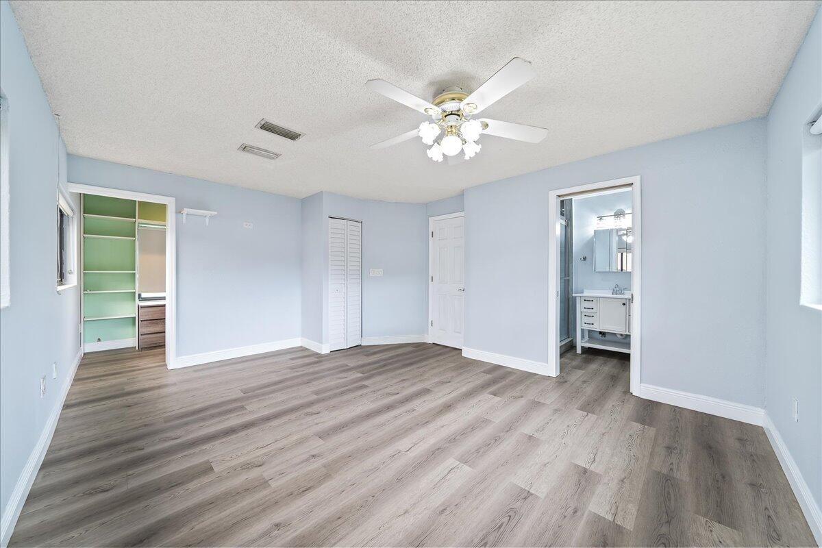 124 Monaco Road Melbourne, FL 32904 - Photo 15 of 24 a view of an empty room with wooden floor