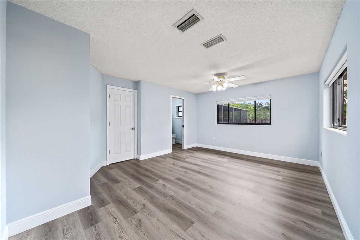 124 Monaco Road Melbourne, FL 32904 - Photo 16 of 24 a view of empty room with wooden floor