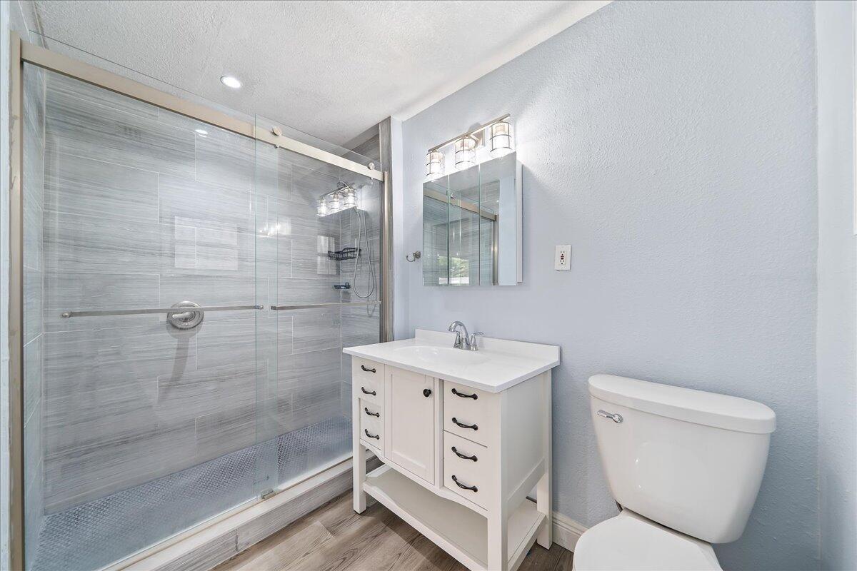 124 Monaco Road Melbourne, FL 32904 - Photo 18 of 24 a bathroom with a toilet sink and shower