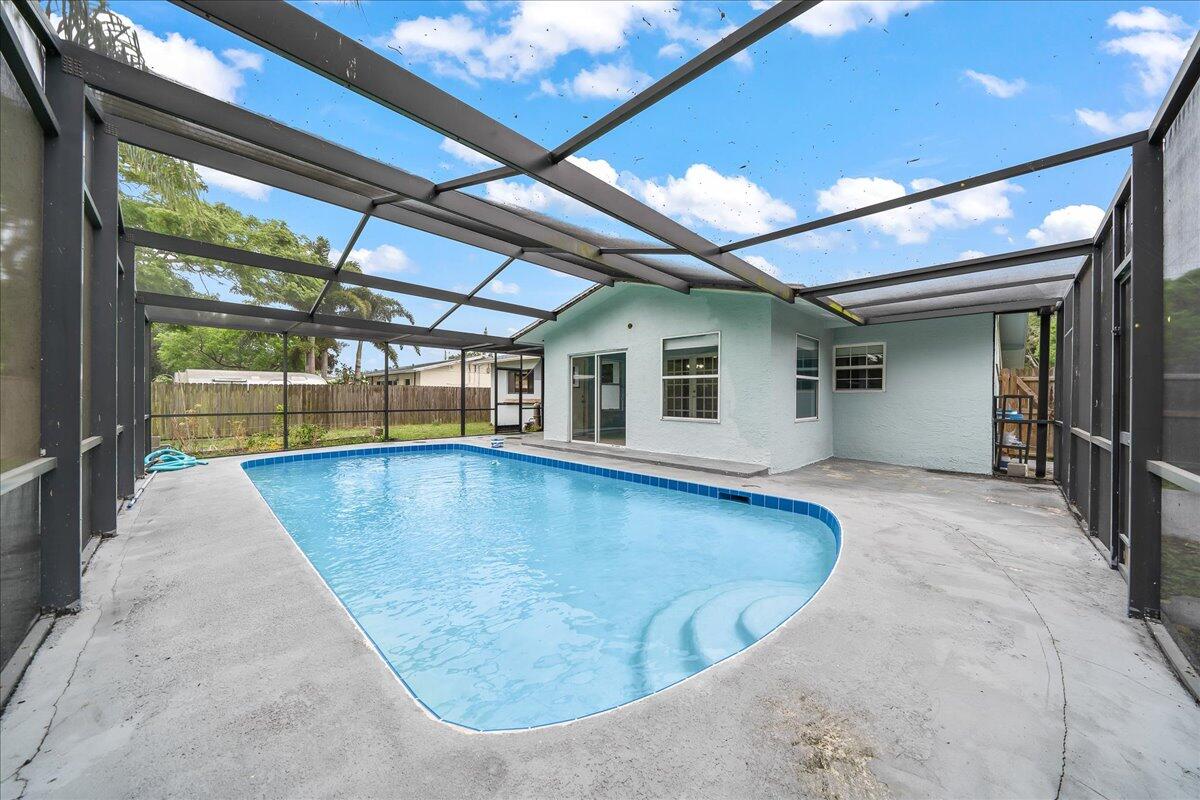 124 Monaco Road Melbourne, FL 32904 - Photo 22 of 24 a view of a swimming pool with a patio