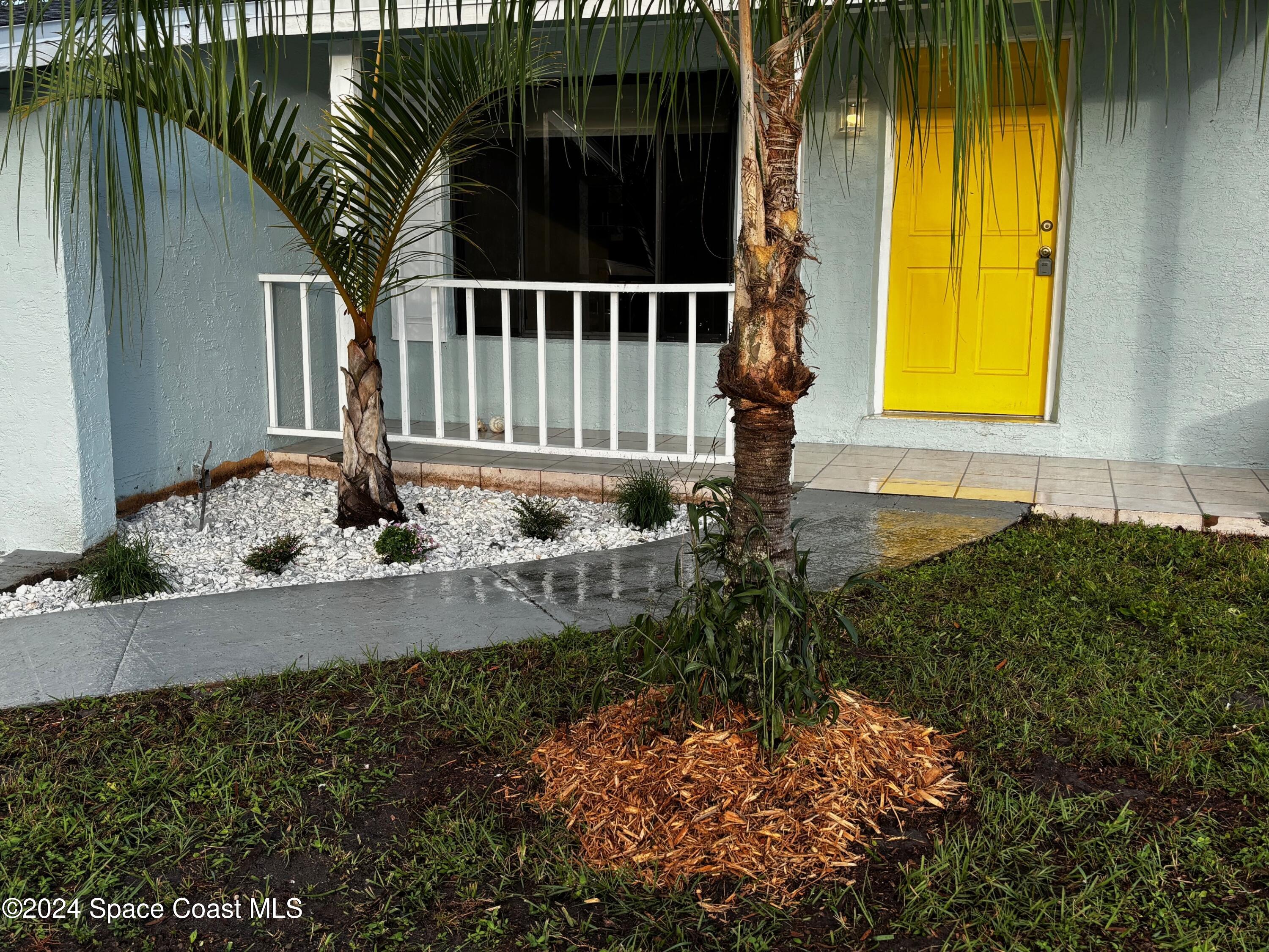 124 Monaco Road Melbourne, FL 32904 - Photo 5 of 24 a view of house with a yard