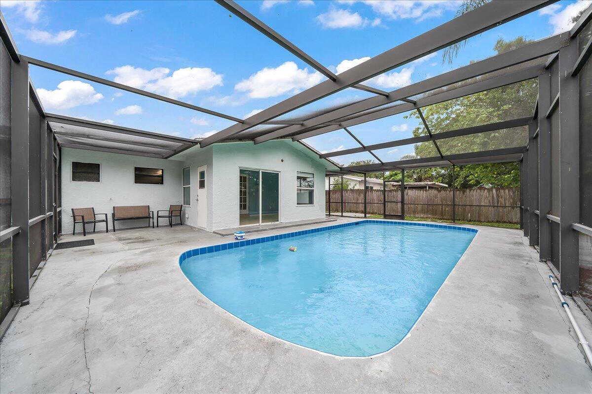 124 Monaco Road Melbourne, FL 32904 - Photo 6 of 24 a view of a swimming pool with a patio