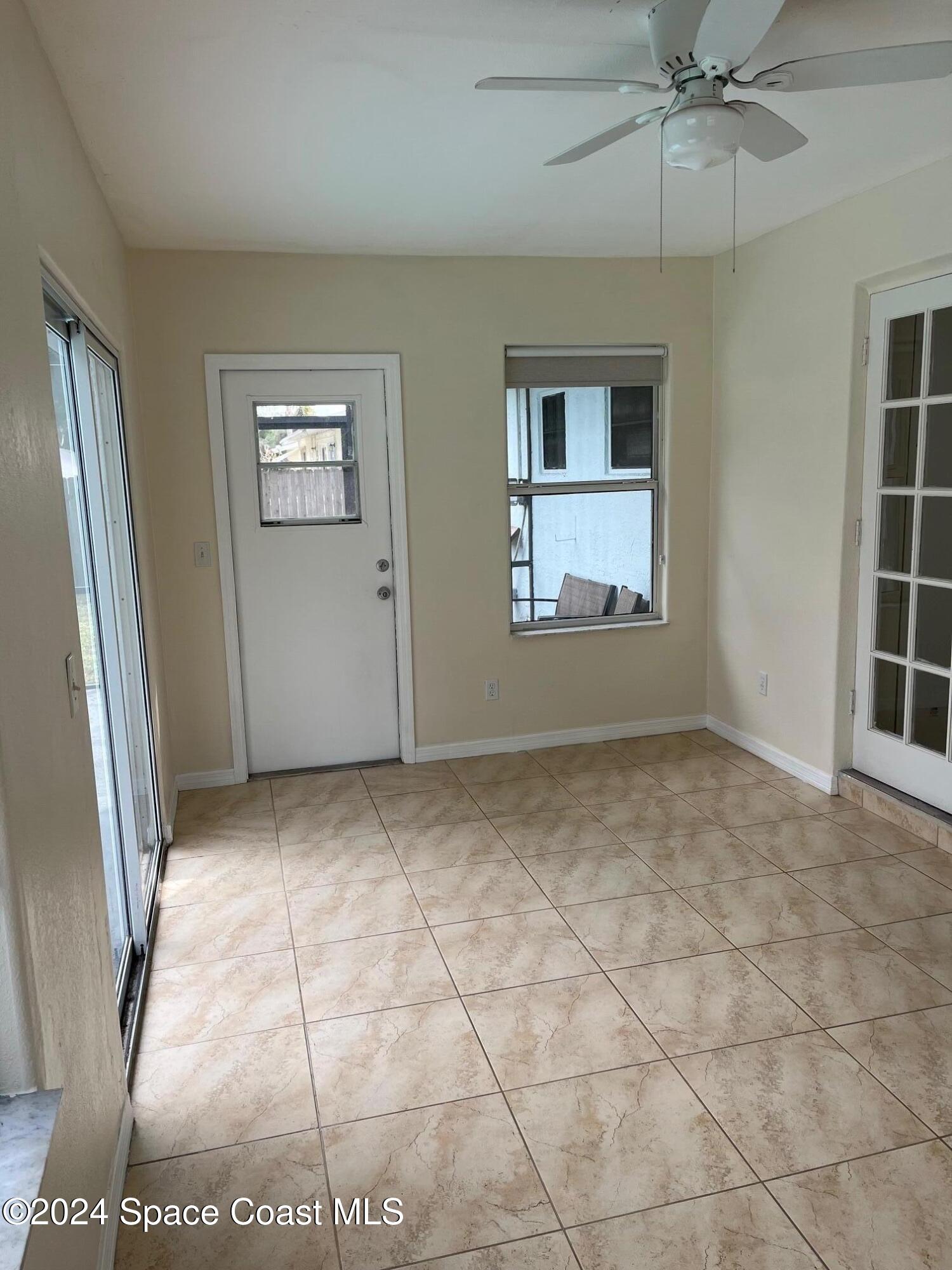 124 Monaco Road Melbourne, FL 32904 - Photo 9 of 24 an empty room with windows and closet