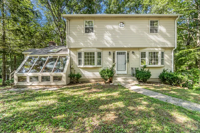 front view of a house with a yard