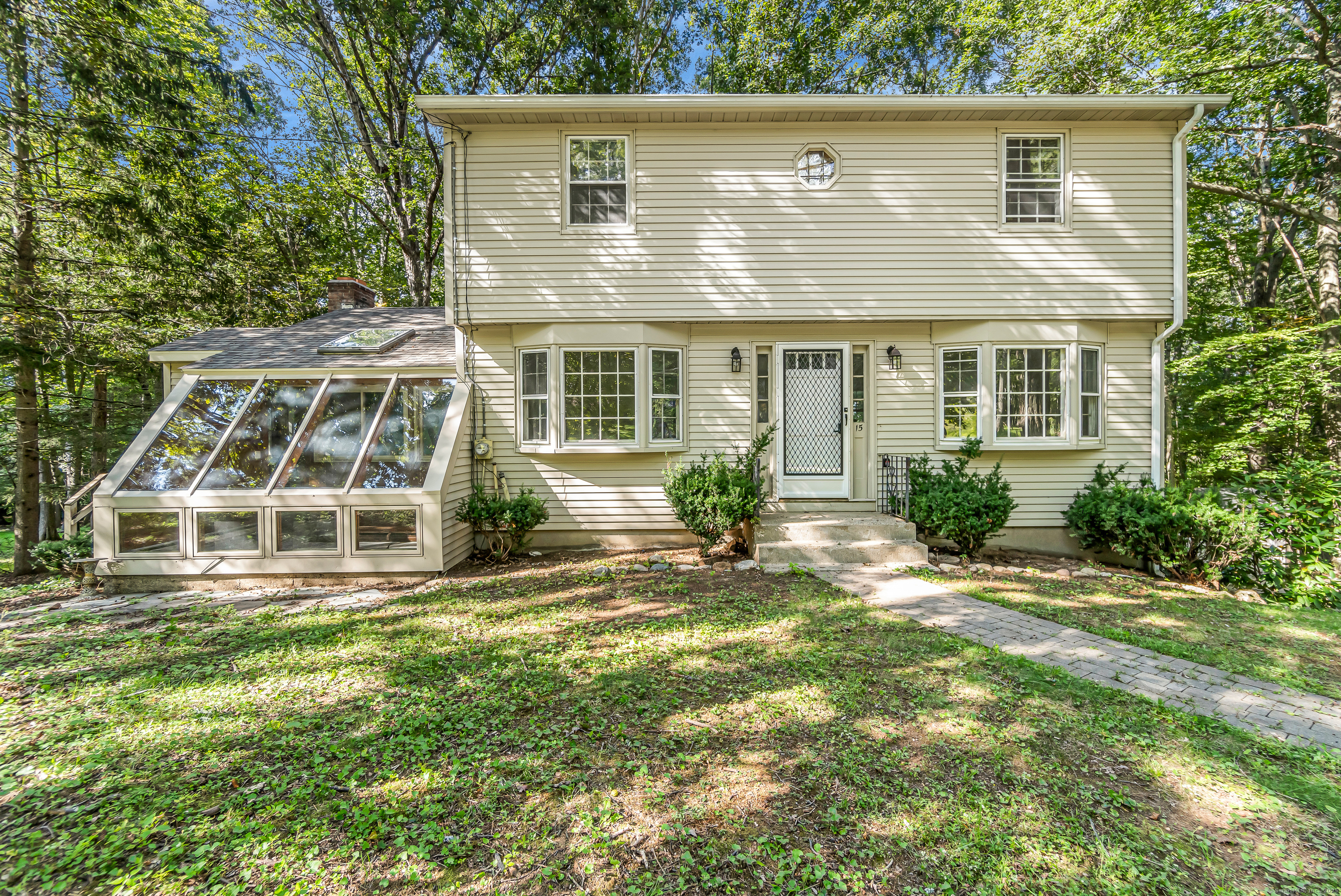 front view of a house with a yard