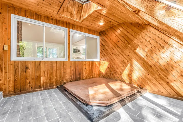 a view of a room with a wooden floor