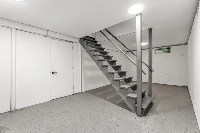 a view of a hallway with staircase