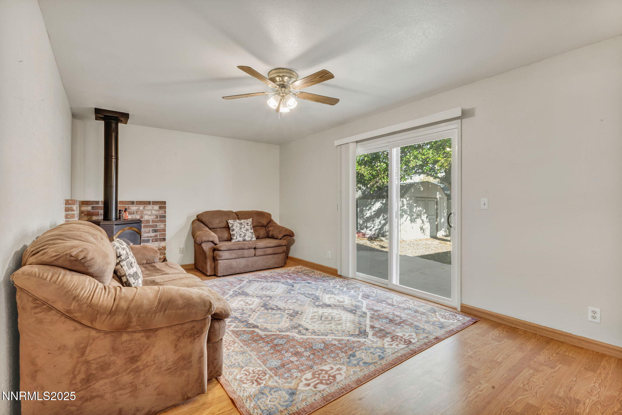 836 E Street Fernley, NV 89408 - Photo 19 of 53 a living room with furniture and a large window