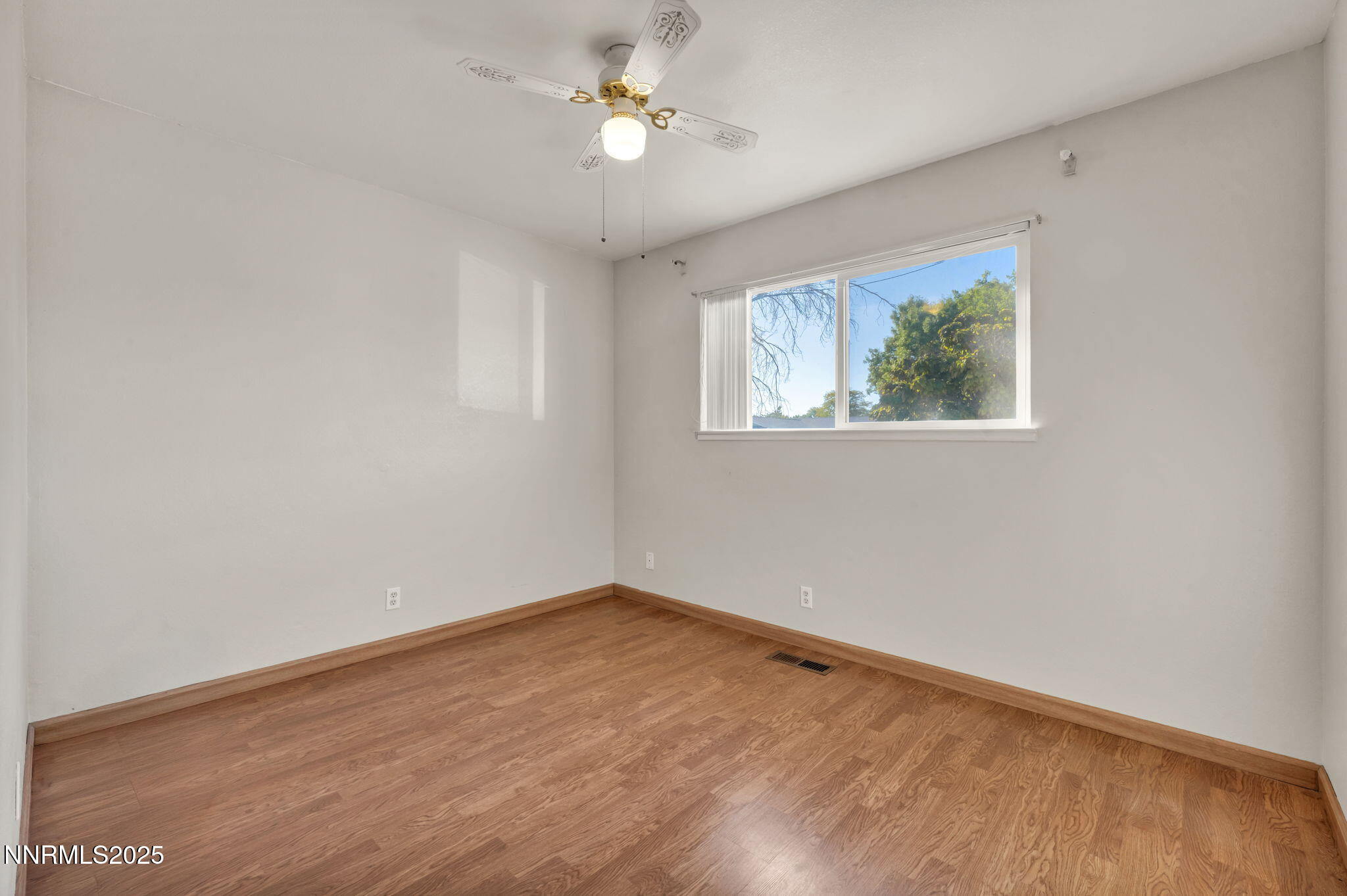 836 E Street Fernley, NV 89408 - Photo 30 of 53 wooden floor in an empty room with a window