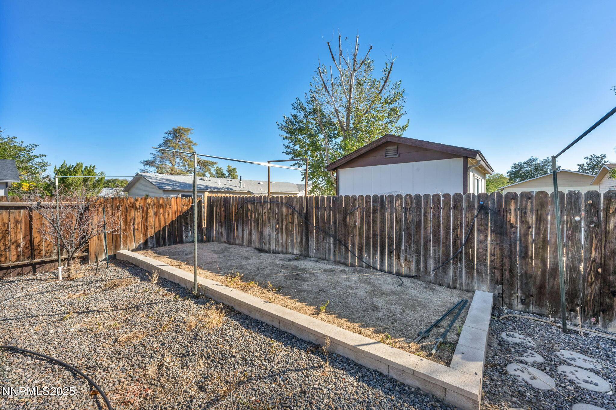 836 E Street Fernley, NV 89408 - Photo 41 of 53 a view of a backyard with wooden fence