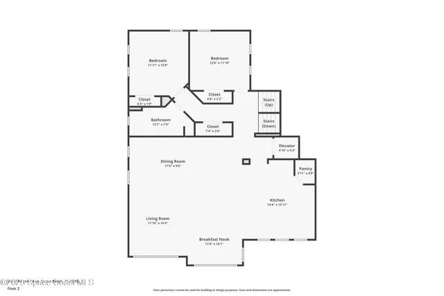 a large kitchen with a large counter top appliances and cabinets