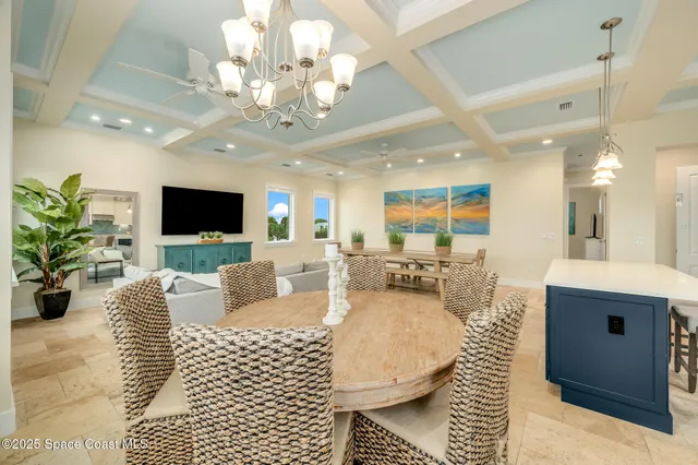 a living room with lots of furniture and a large window