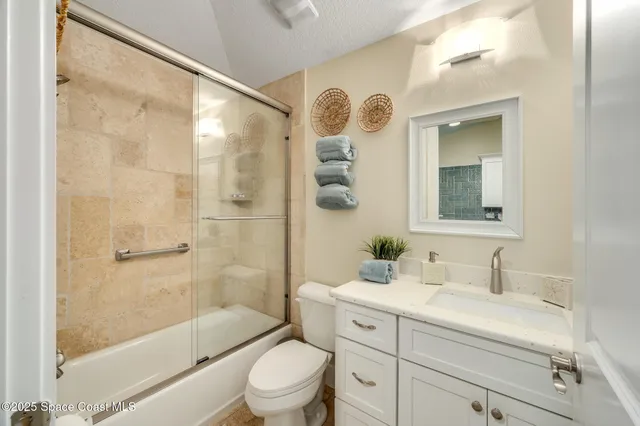 a view of a backyard with a patio and a garden