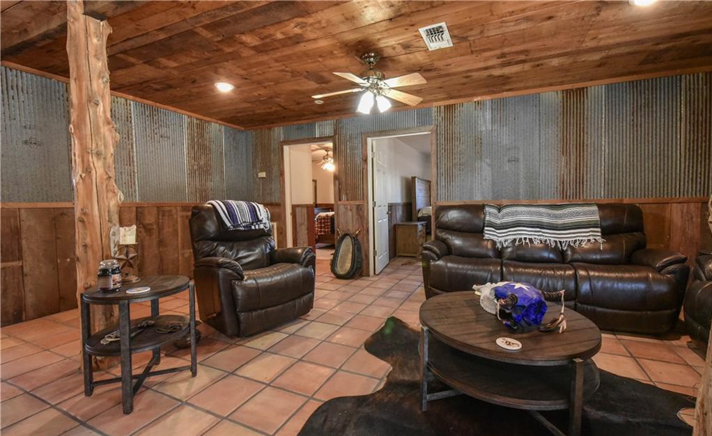 12200 Winn Road Franklin, TX 77856 - Photo 5 of 33 a living room with furniture and a chandelier