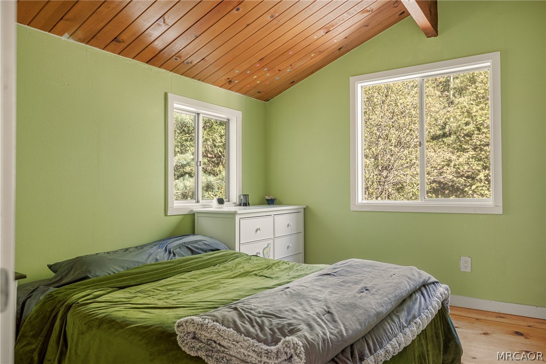 316 Pioneer Road Lake Arrowhead, CA 92352 - Photo 19 of 35 a bedroom with a bed and a window