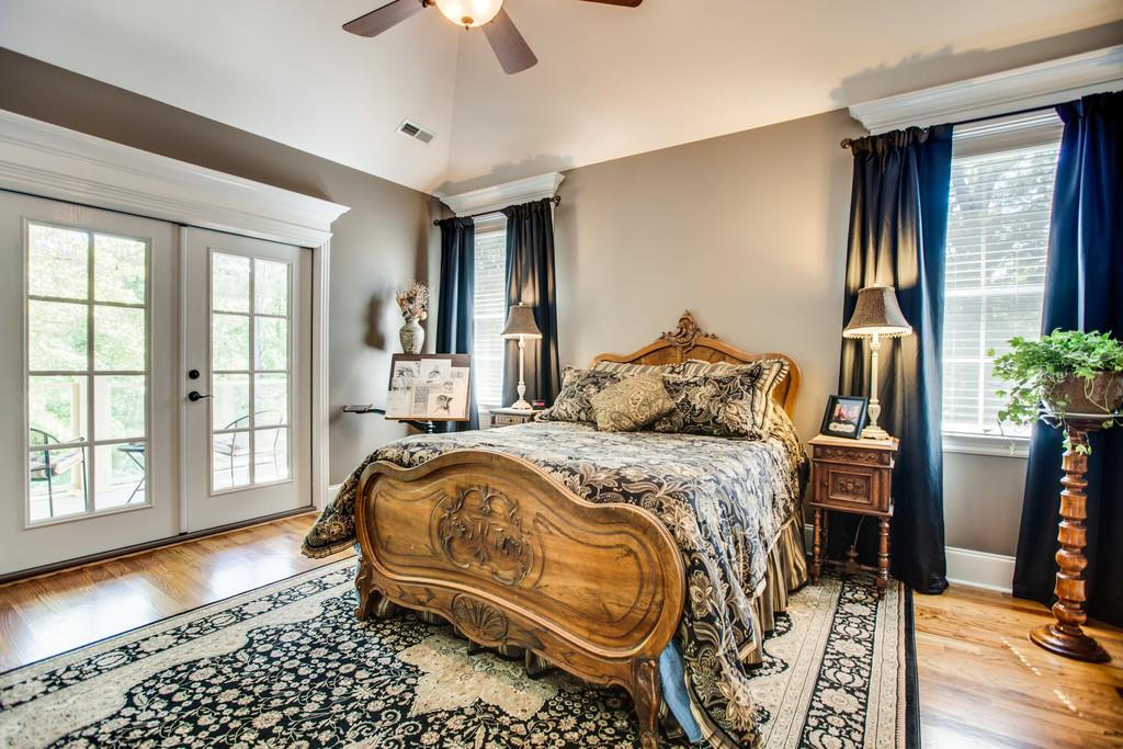 5939 Greenbriar Road Franklin, TN 37064 - Photo 11 of 30 a bedroom with a bed and wooden floor