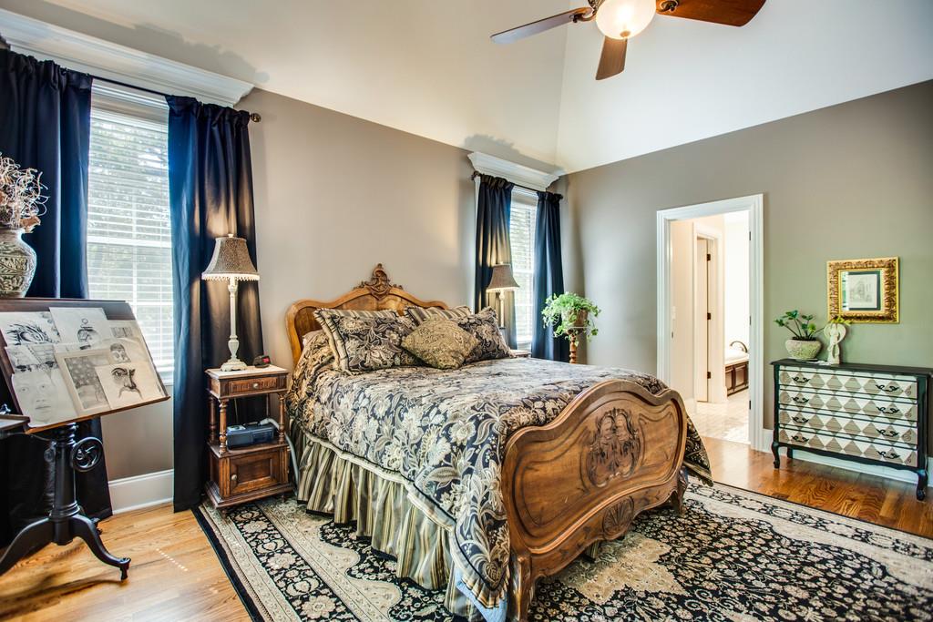 5939 Greenbriar Road Franklin, TN 37064 - Photo 12 of 30 a bedroom with a bed and wooden floor