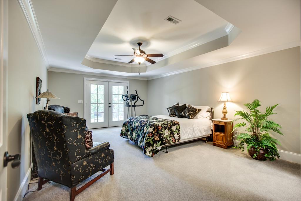 5939 Greenbriar Road Franklin, TN 37064 - Photo 22 of 30 a spacious bedroom with bed and a couch