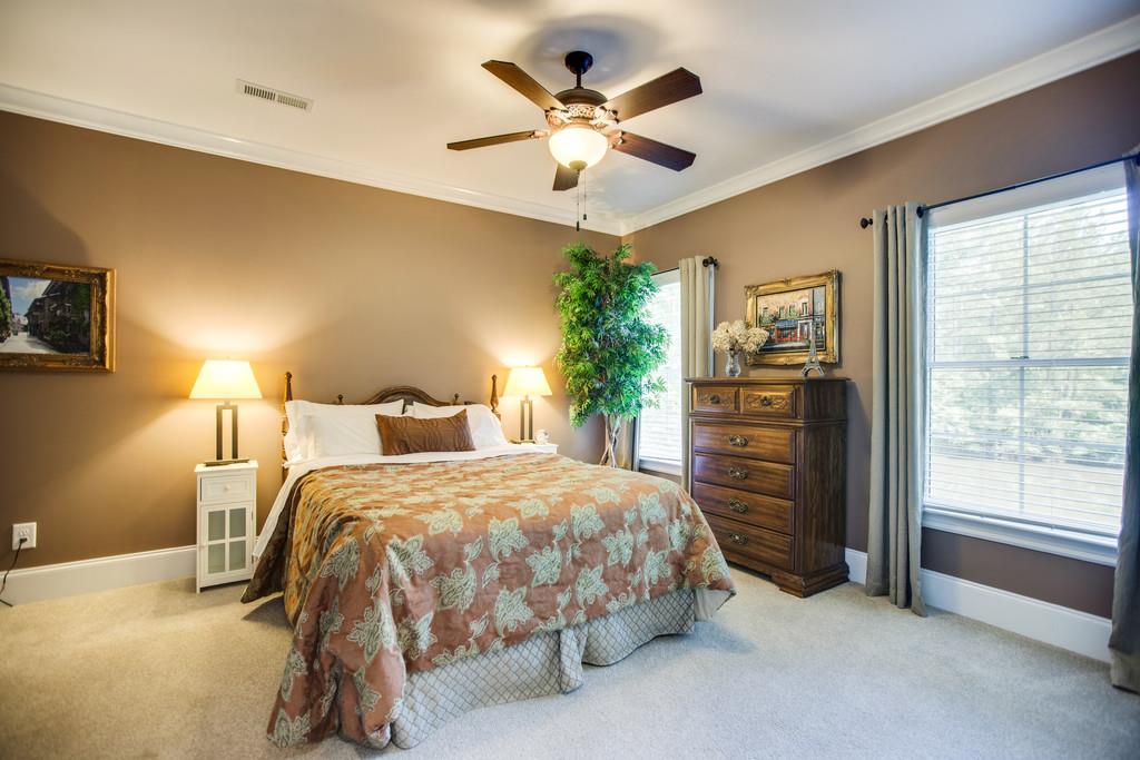 5939 Greenbriar Road Franklin, TN 37064 - Photo 23 of 30 a bedroom with a bed and ceiling fan
