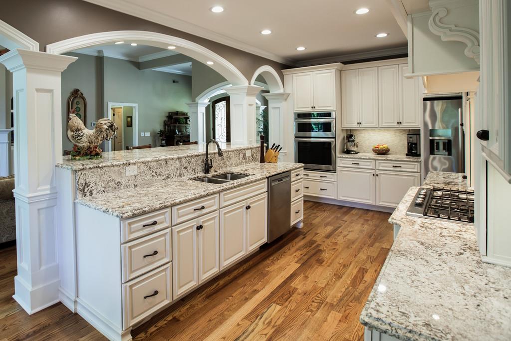 5939 Greenbriar Road Franklin, TN 37064 - Photo 7 of 30 a large kitchen with kitchen island a sink stainless steel appliances and cabinets