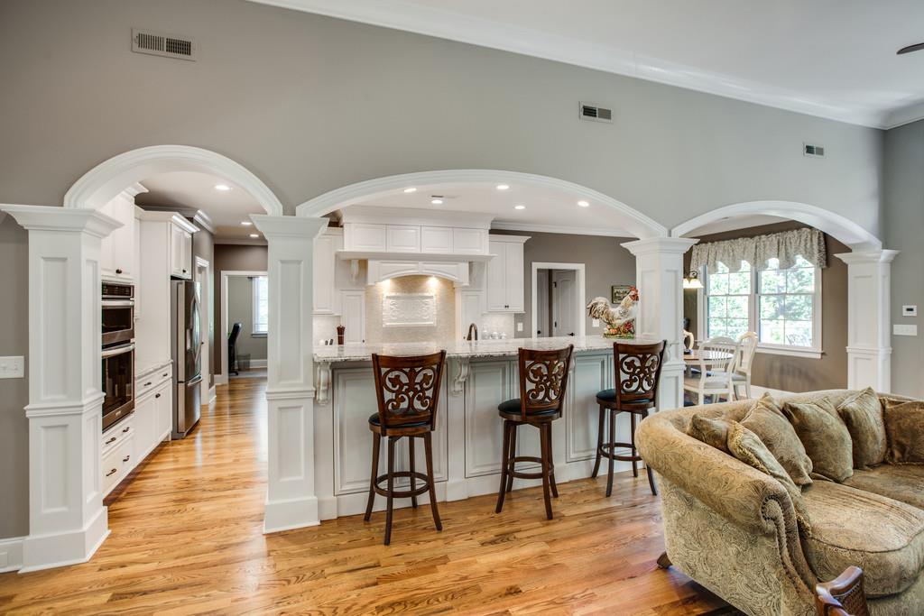 5939 Greenbriar Road Franklin, TN 37064 - Photo 9 of 30 a view of a dining room with furniture and wooden floor