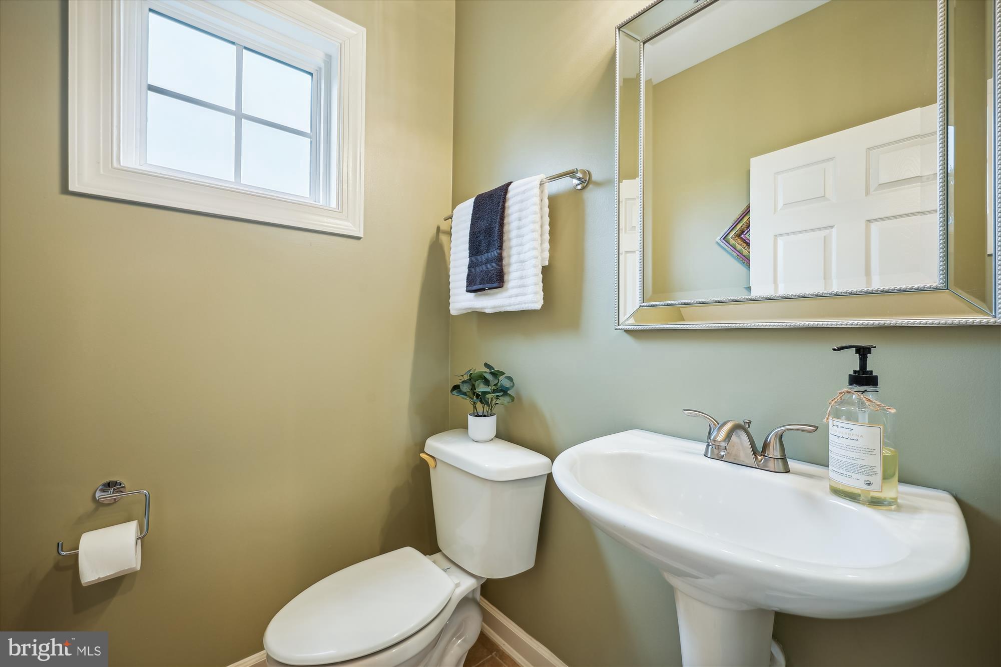 7321 Brink Road Laytonsville, MD 20882 - Photo 17 of 55 a bathroom with a sink mirror and toilet