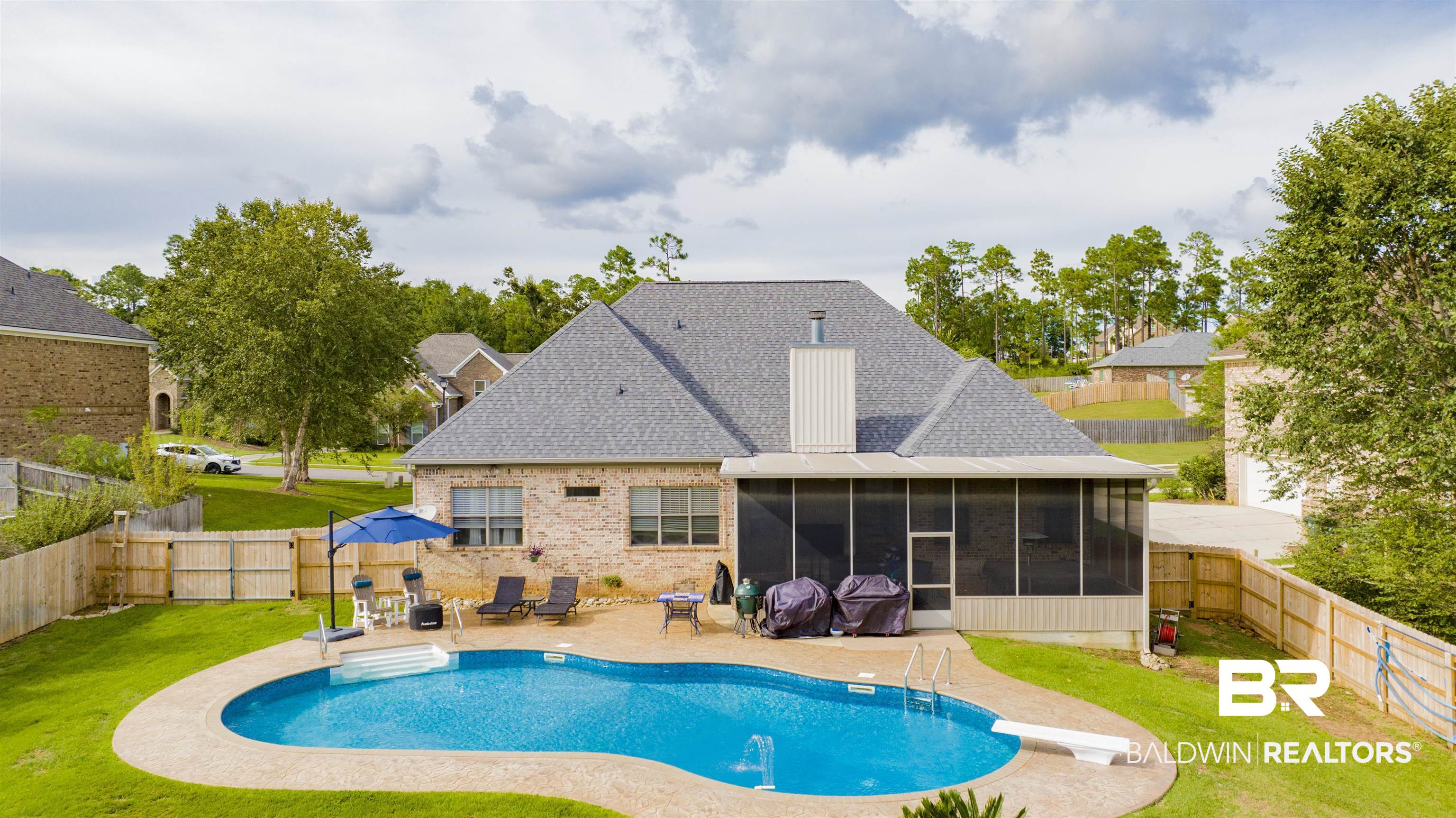 12418 Cambron Trail Daphne, AL 36527 - Photo 13 of 44 View of pool featuring a yard, a diving board, a patio area, and a sunroom