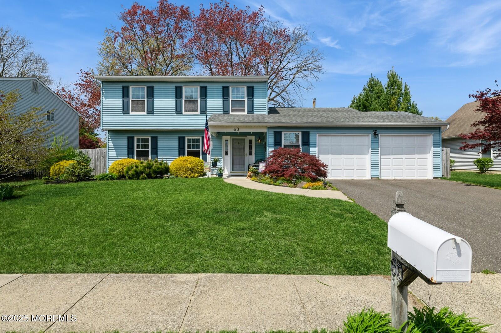 60 Appletree Road Howell, NJ 07731 - Photo 1 of 28 a front view of a house with garden
