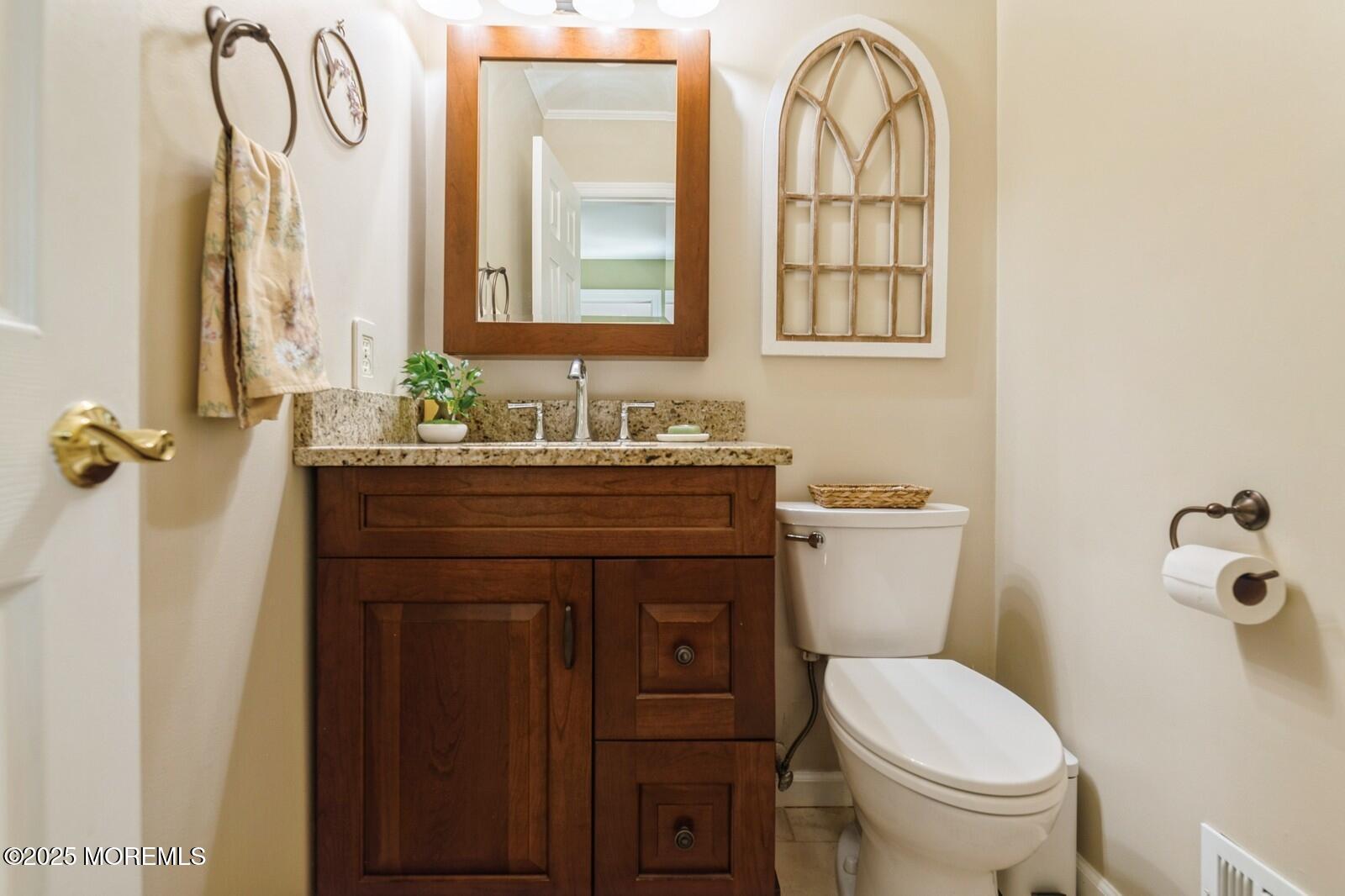 60 Appletree Road Howell, NJ 07731 - Photo 13 of 28 a bathroom with a sink a toilet and a mirror