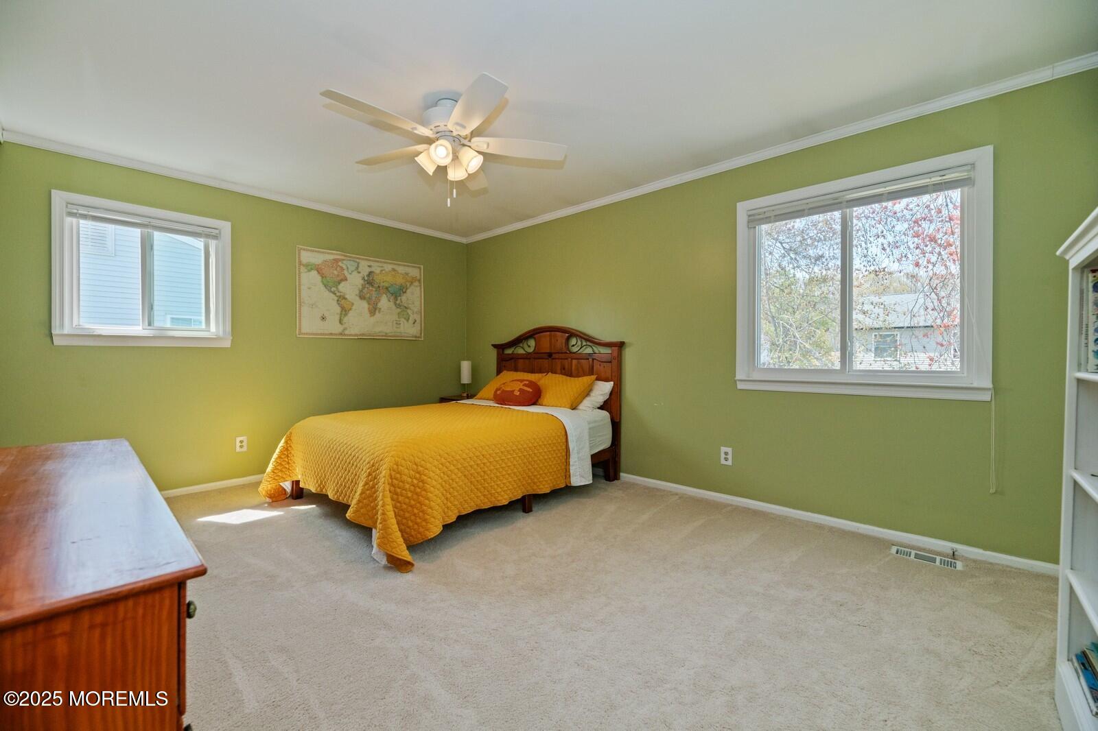 60 Appletree Road Howell, NJ 07731 - Photo 14 of 28 a bed sitting in a bedroom next to a window