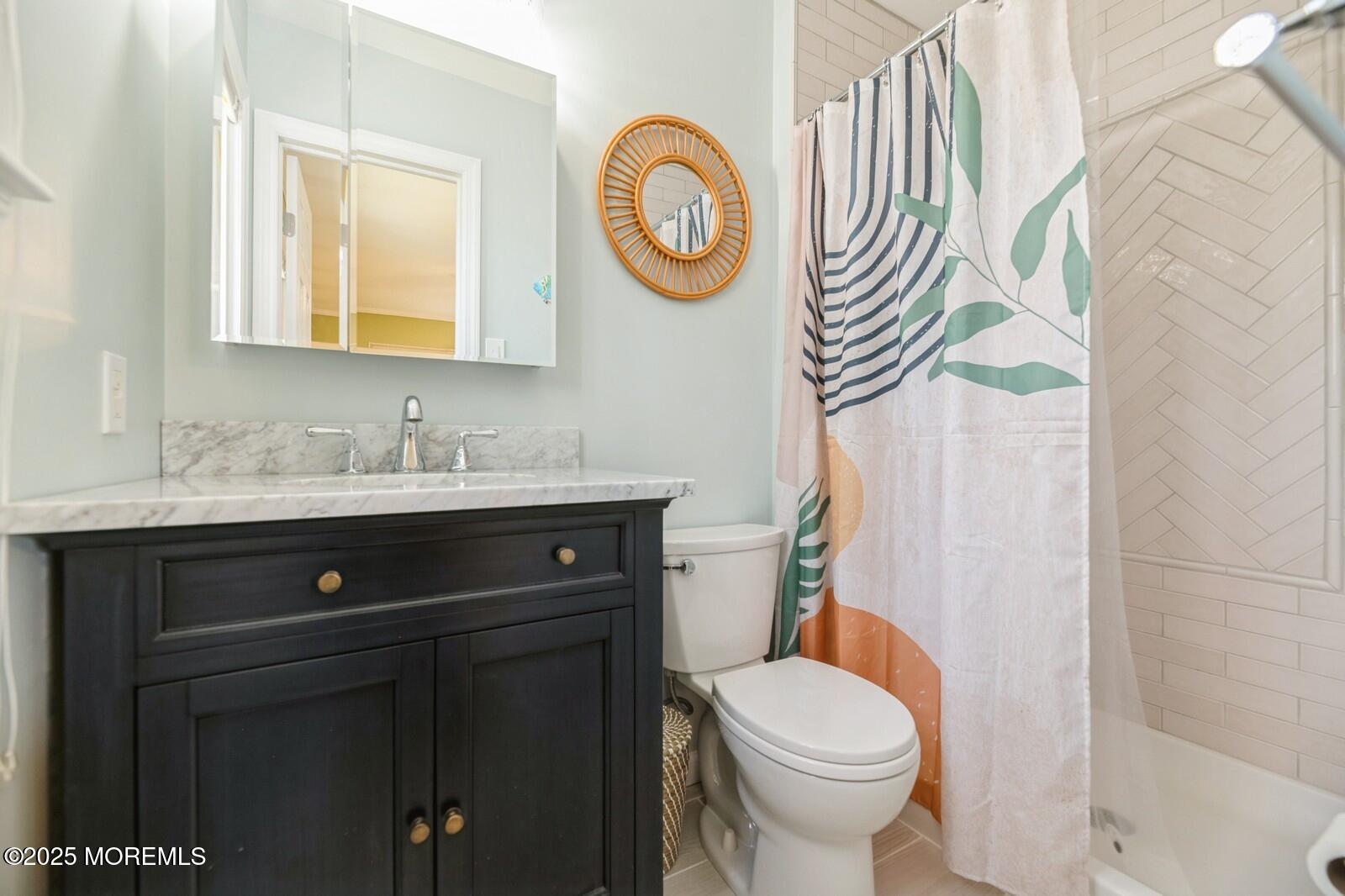 60 Appletree Road Howell, NJ 07731 - Photo 15 of 28 a bathroom with a sink a toilet and a mirror