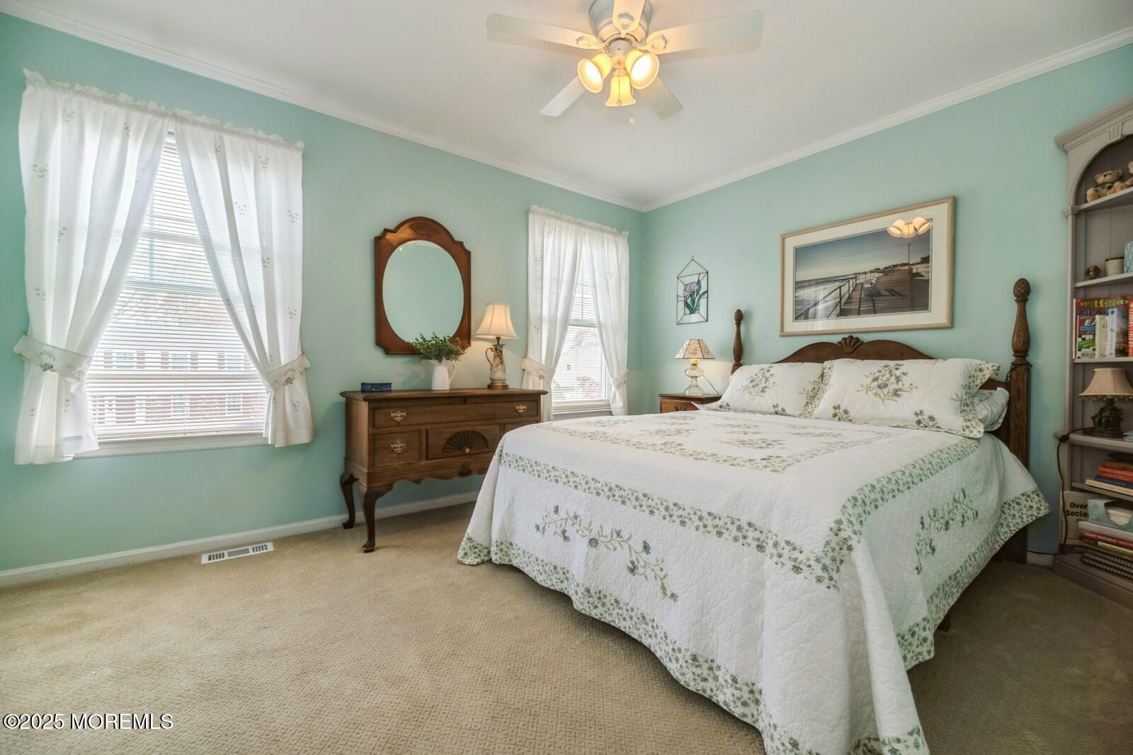 60 Appletree Road Howell, NJ 07731 - Photo 16 of 28 a bedroom with a bed mirror and a window