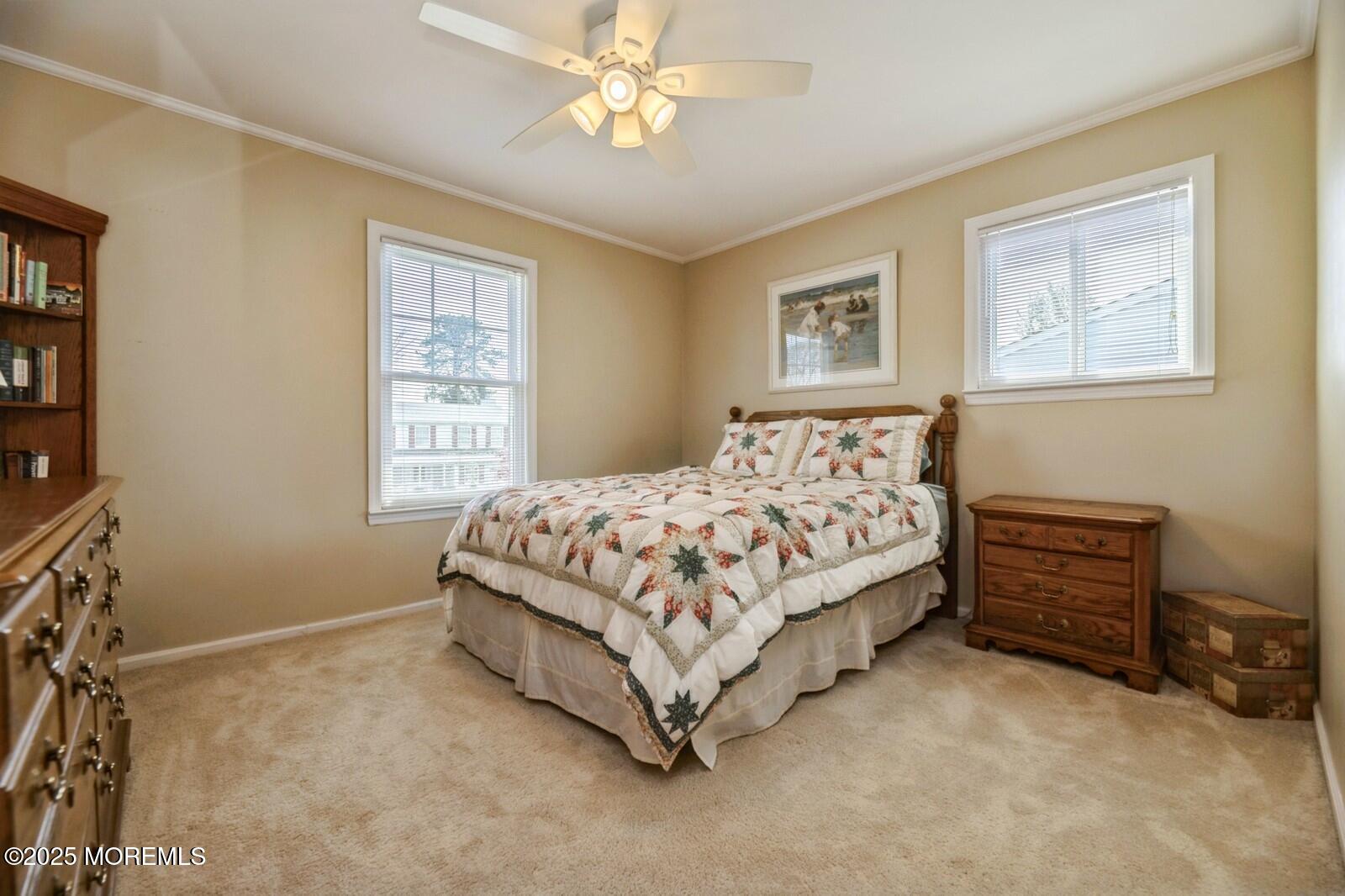 60 Appletree Road Howell, NJ 07731 - Photo 17 of 28 a bedroom with a bed dresser and a window