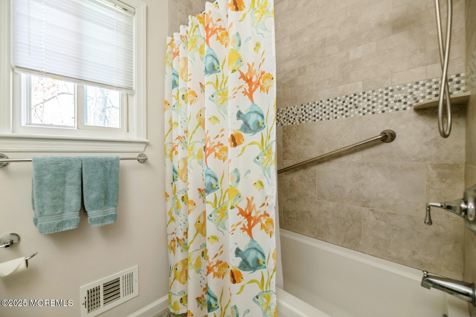 60 Appletree Road Howell, NJ 07731 - Photo 19 of 28 a bathroom with a bathtub and shower
