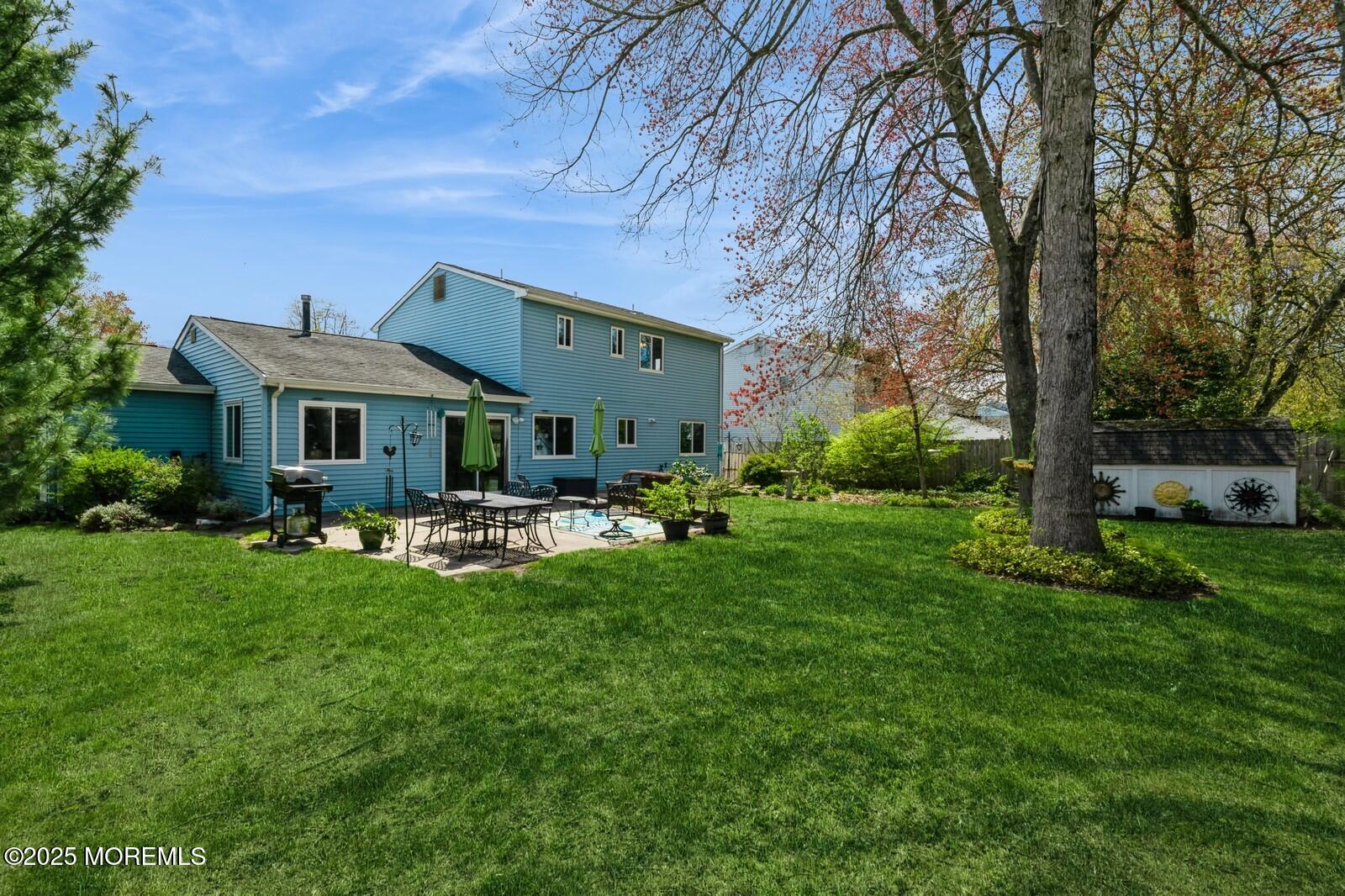 60 Appletree Road Howell, NJ 07731 - Photo 26 of 28 a front view of a house with garden and trees