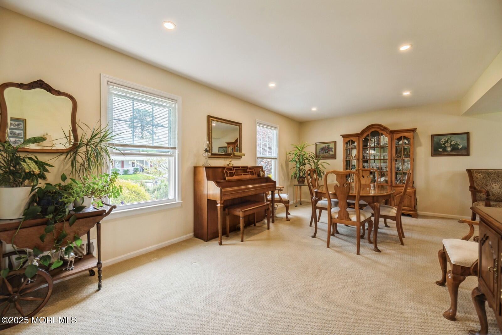 60 Appletree Road Howell, NJ 07731 - Photo 4 of 28 a living room with furniture a flat screen tv and a window