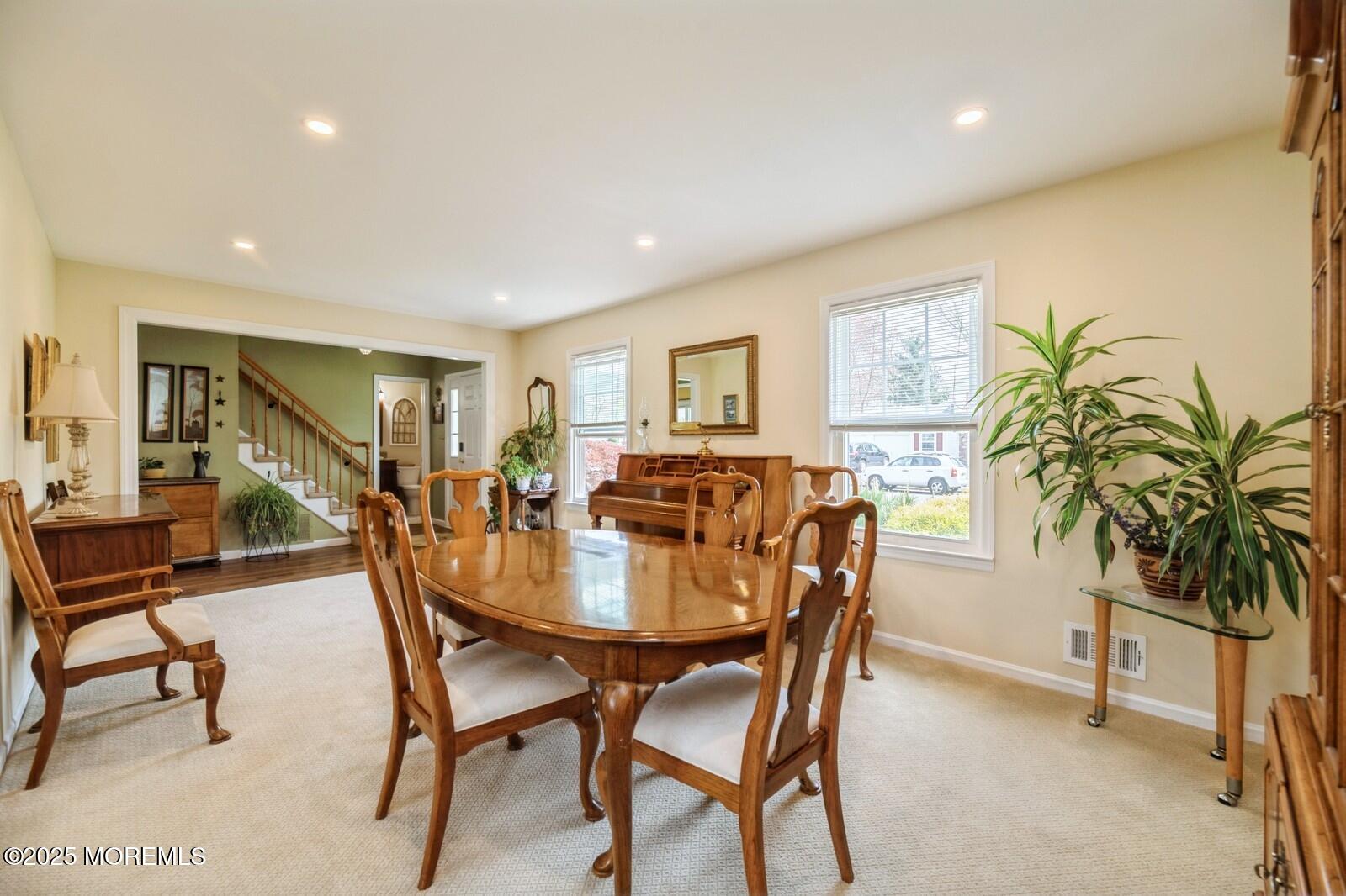 60 Appletree Road Howell, NJ 07731 - Photo 5 of 28 a view of a dining room with furniture and a potted plant