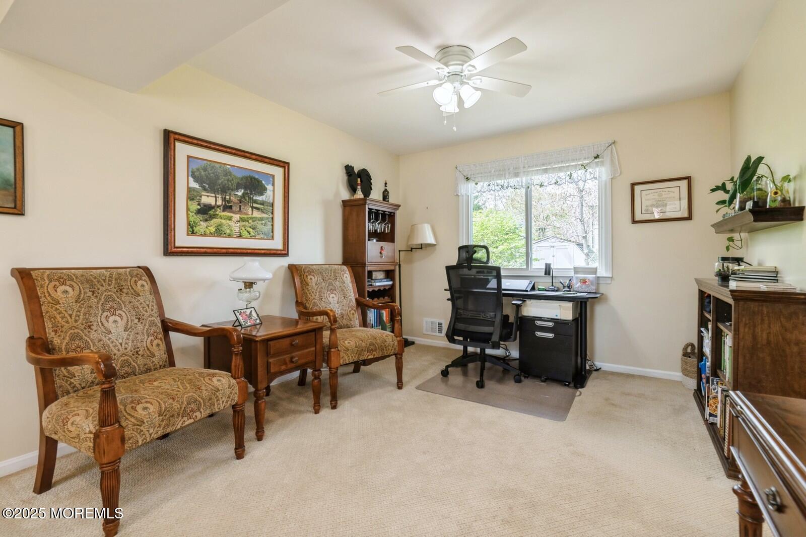 60 Appletree Road Howell, NJ 07731 - Photo 6 of 28 a view of a livingroom with workspace and a couch