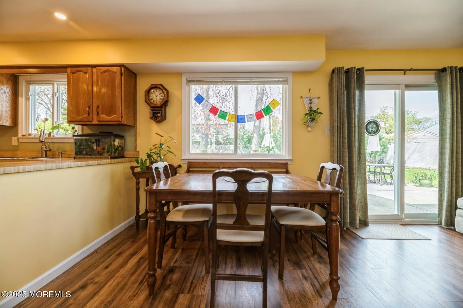 60 Appletree Road Howell, NJ 07731 - Photo 9 of 28 a view of a a dining room with furniture window and wooden floor