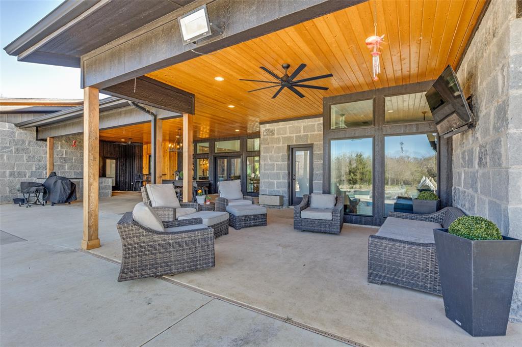 2687 North Trinity Street Decatur, TX 76234 - Photo 28 of 33 a building outdoor space with patio furniture and potted plants