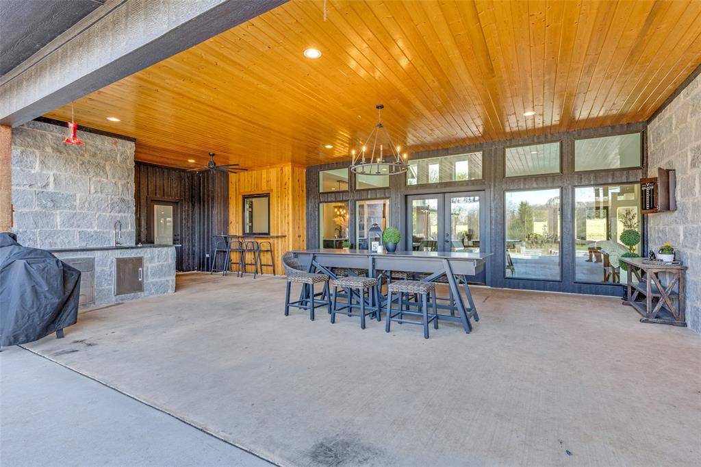 2687 North Trinity Street Decatur, TX 76234 - Photo 29 of 33 a view of a patio with table and chairs
