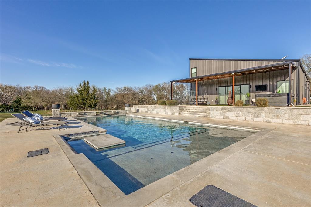 2687 North Trinity Street Decatur, TX 76234 - Photo 30 of 33 a view of a house with swimming pool