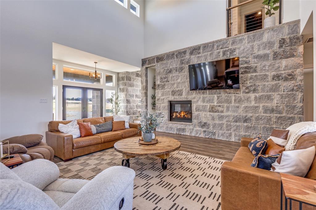 2687 North Trinity Street Decatur, TX 76234 - Photo 6 of 33 a living room with furniture or fireplace and a flat screen tv
