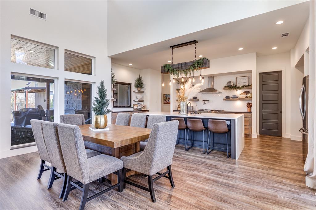 2687 North Trinity Street Decatur, TX 76234 - Photo 10 of 33 a dining room with furniture and wooden floor