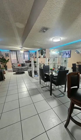 a living room with lots of furniture and a view of living room