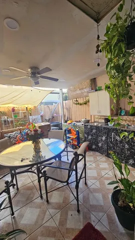 a view of a chairs and table in a patio