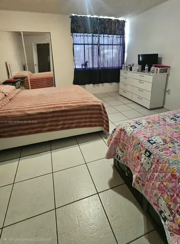 a bedroom with a bed a mirror and dresser