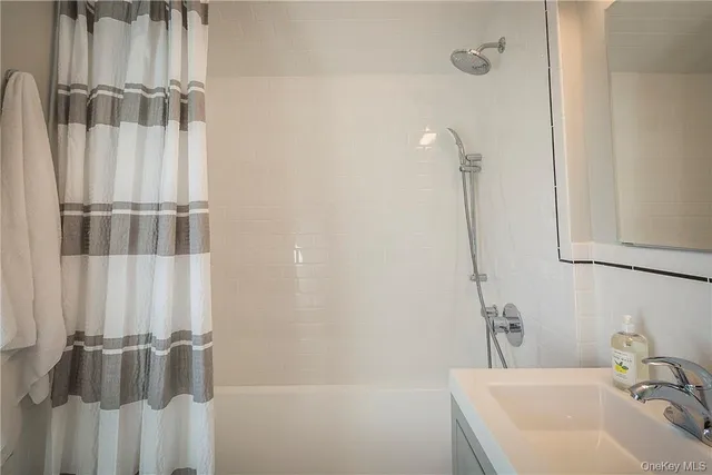 a bathroom with a sink and a shower