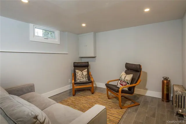a living room with furniture and a rug
